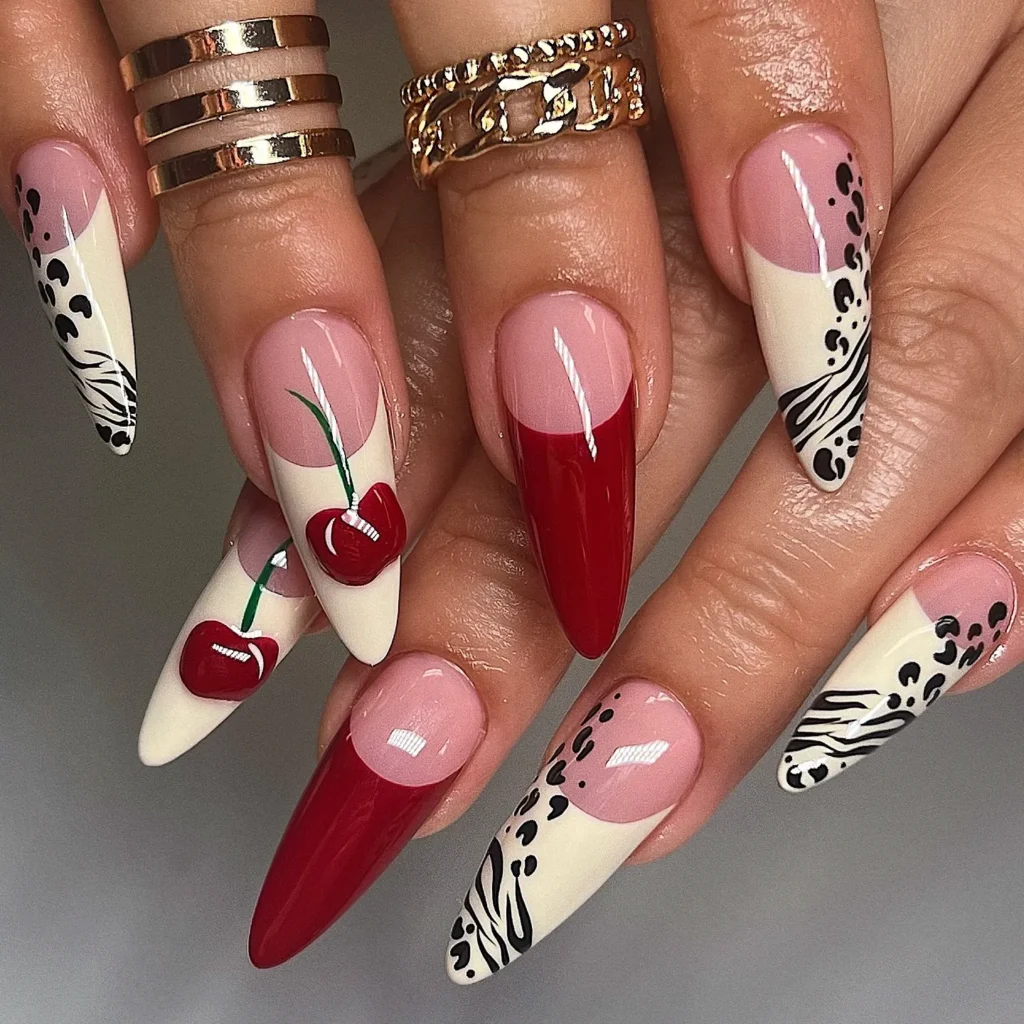 cheetah and zebra print French tip long almond nails with a 3D cherry charm accent