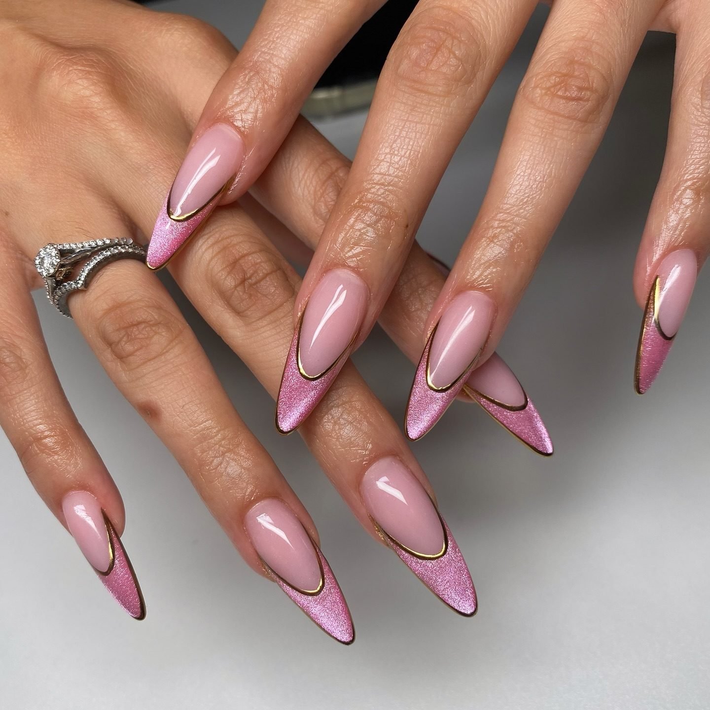 Pink cat-eye chrome French tip almond acrylic nails