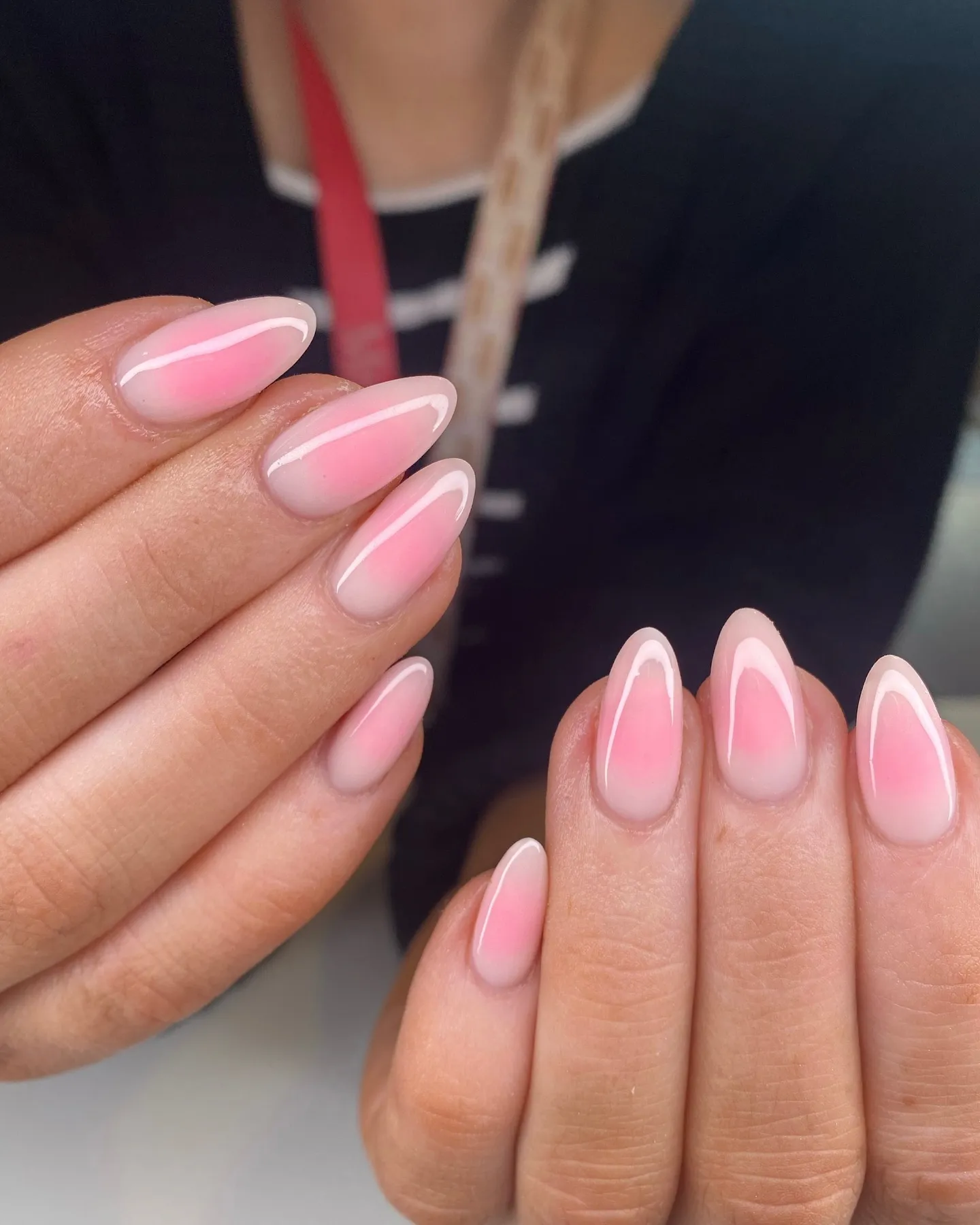 Short almond nails with pink aura blush and white outline