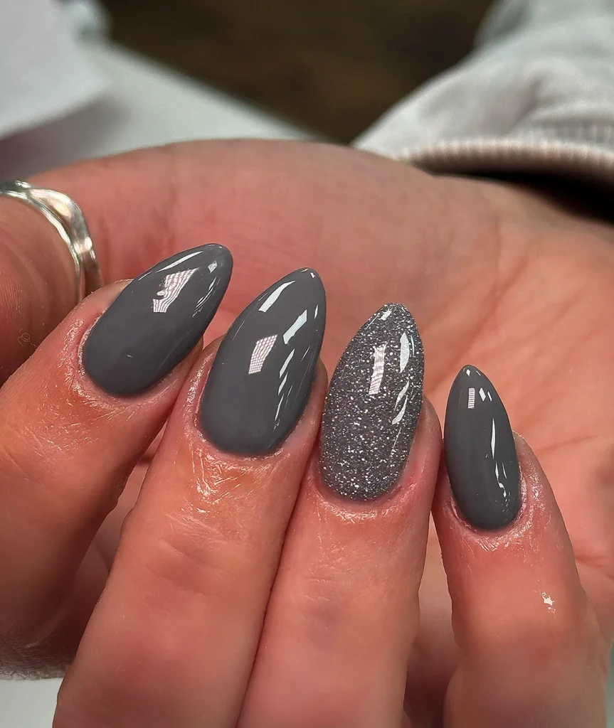 gray almond nails with a single glitter accent nail