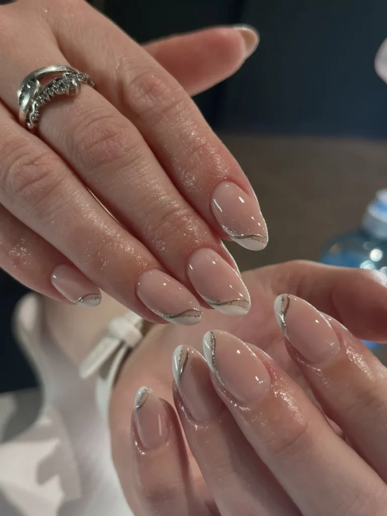 white and silver negative space almond nails