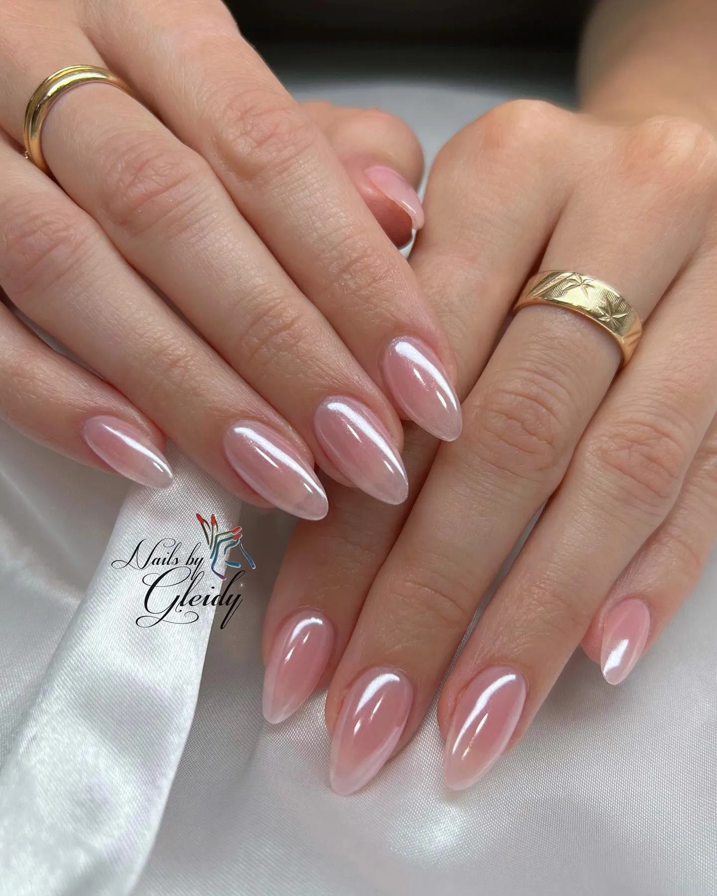Short almond pink nails with pearlescent chrome shimmer
