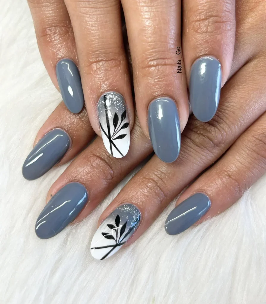gray glossy almond nails with white glitter accent and black line art