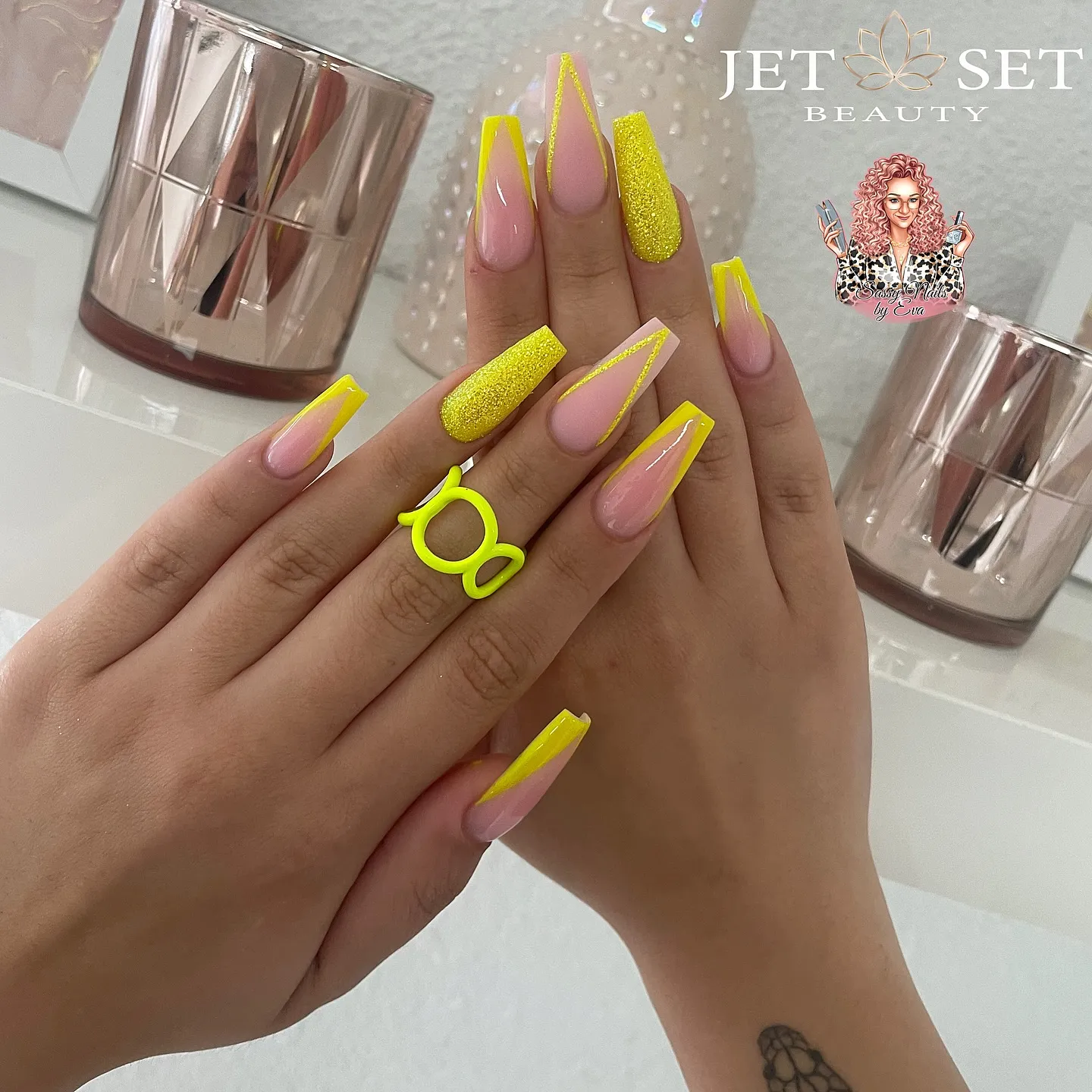 Coffin nails with nude base, neon yellow outline tips, and a neon yellow glitter accent nail