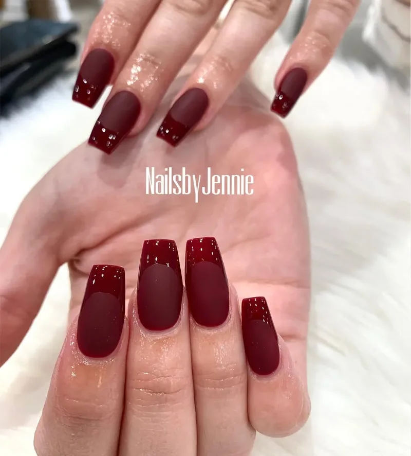 Short matte burgundy coffin nails with a glossy tip