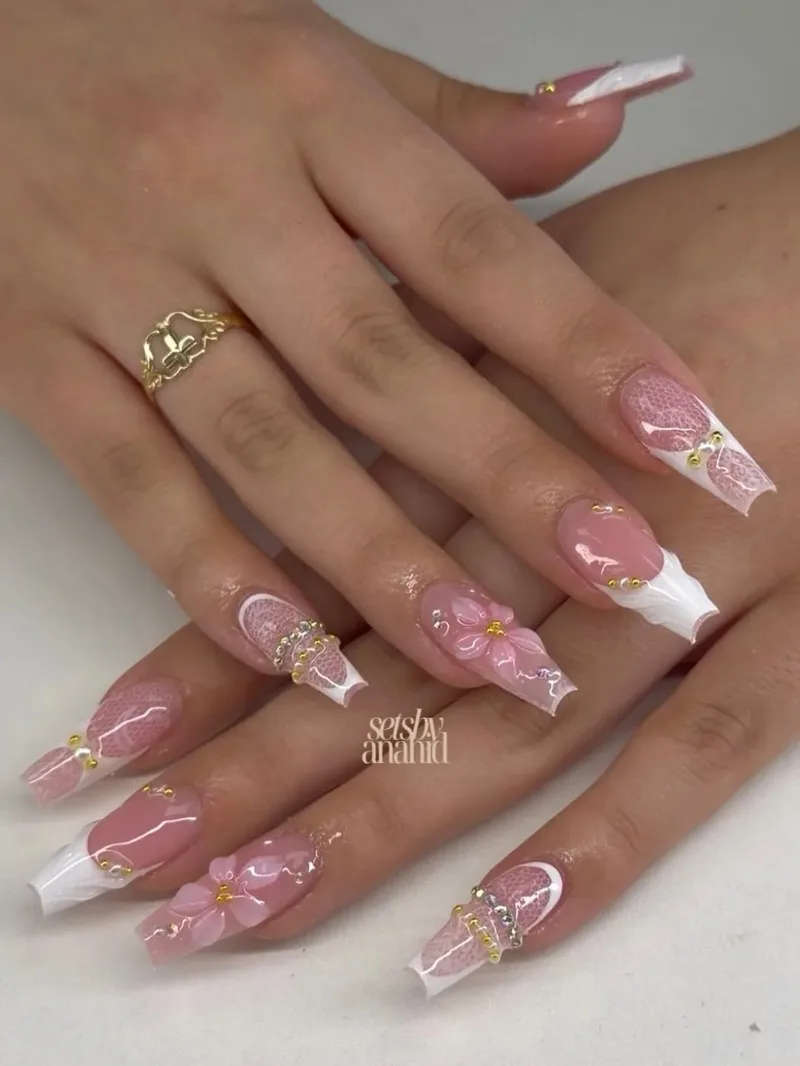 Coffin nails with white French tips, small pink flowers and gems