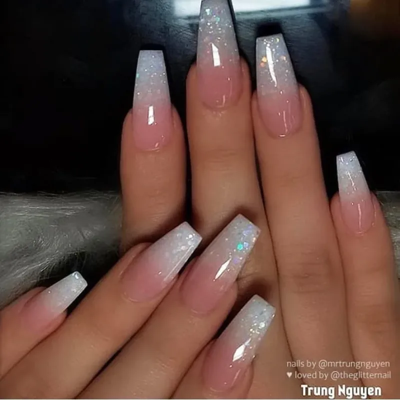 Long coffin nails with a milky white ombre tip and fine glitter