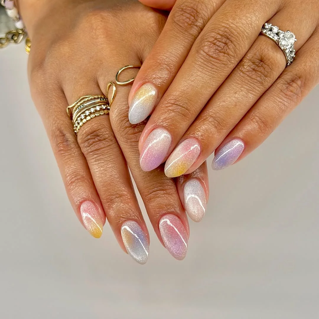 Pastel pink and yellow aura cat-eye almond nails