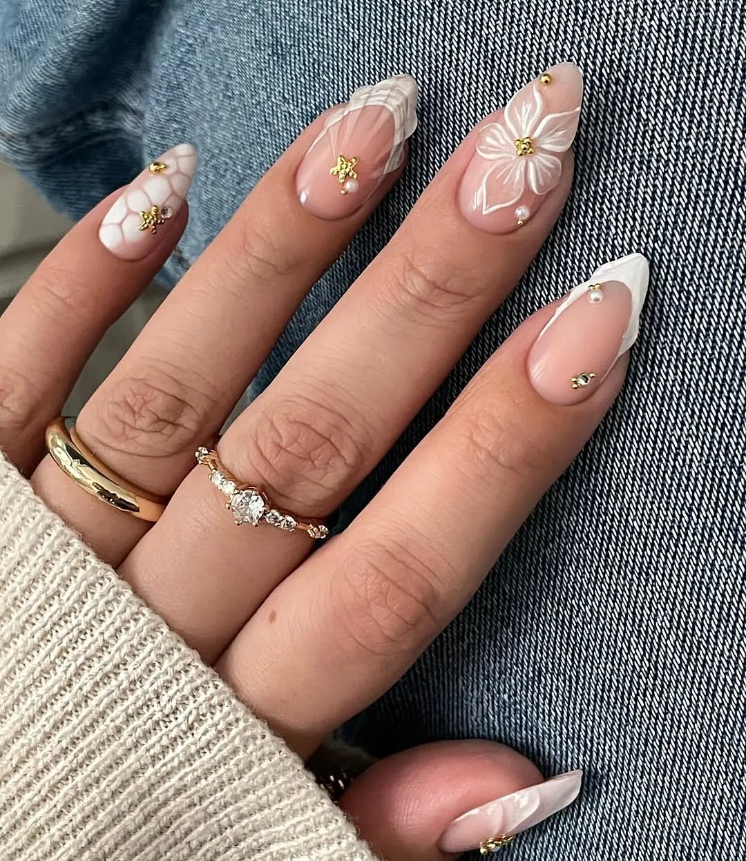 Nude French tip nails with tiny gold details