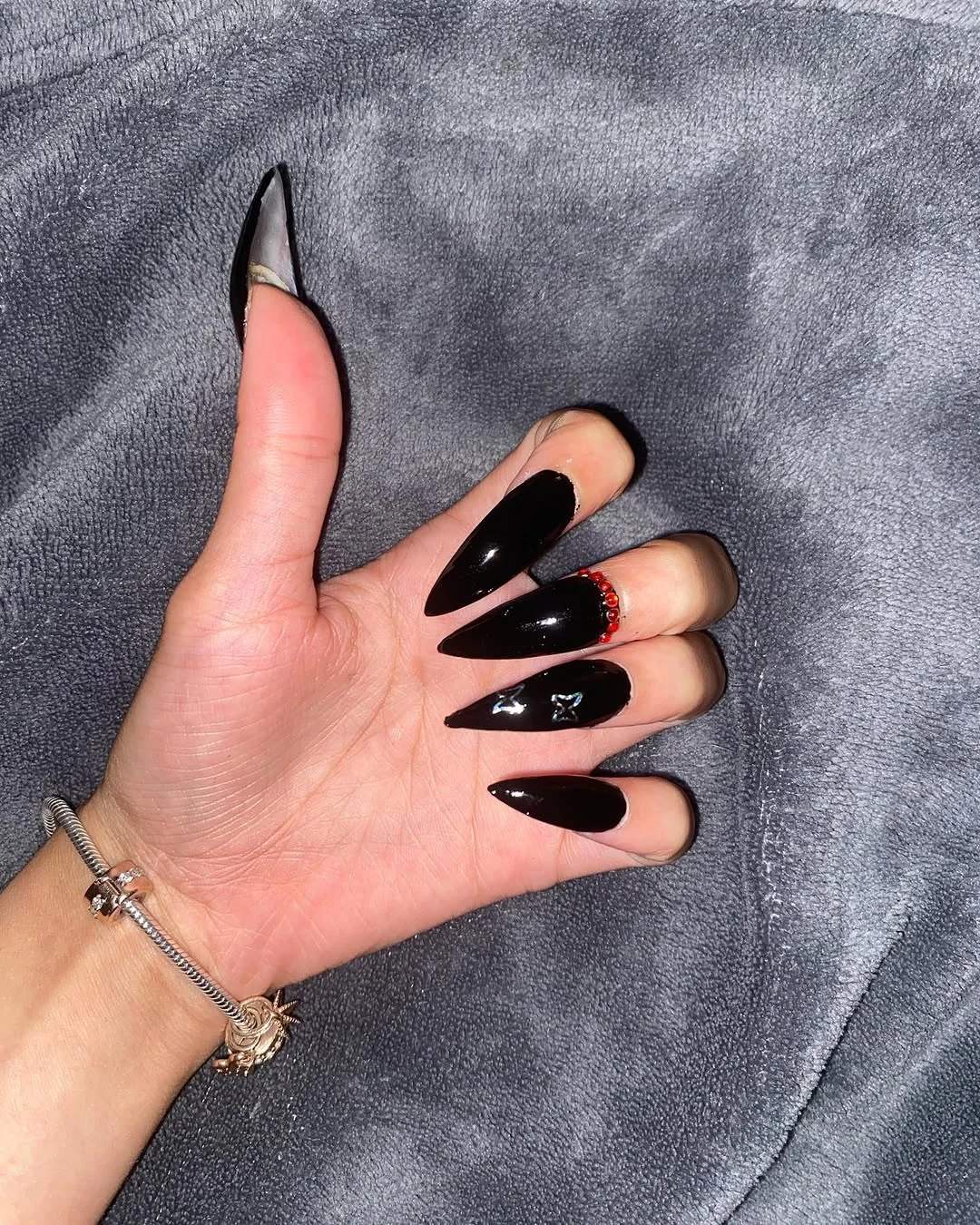 Glossy Black Stiletto nail design idea