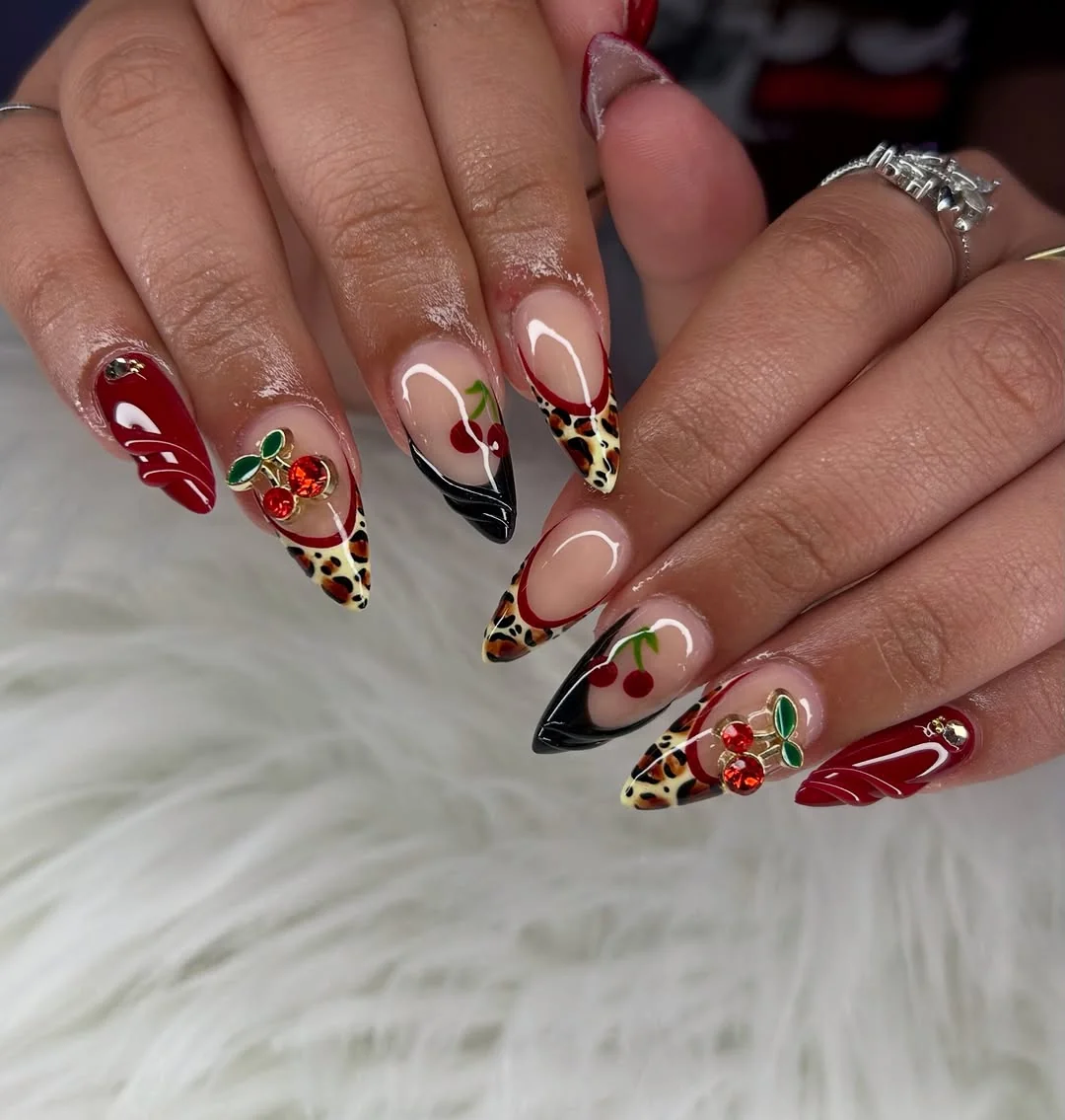 Red, black and leopard print almond nails with glossy cherry art
