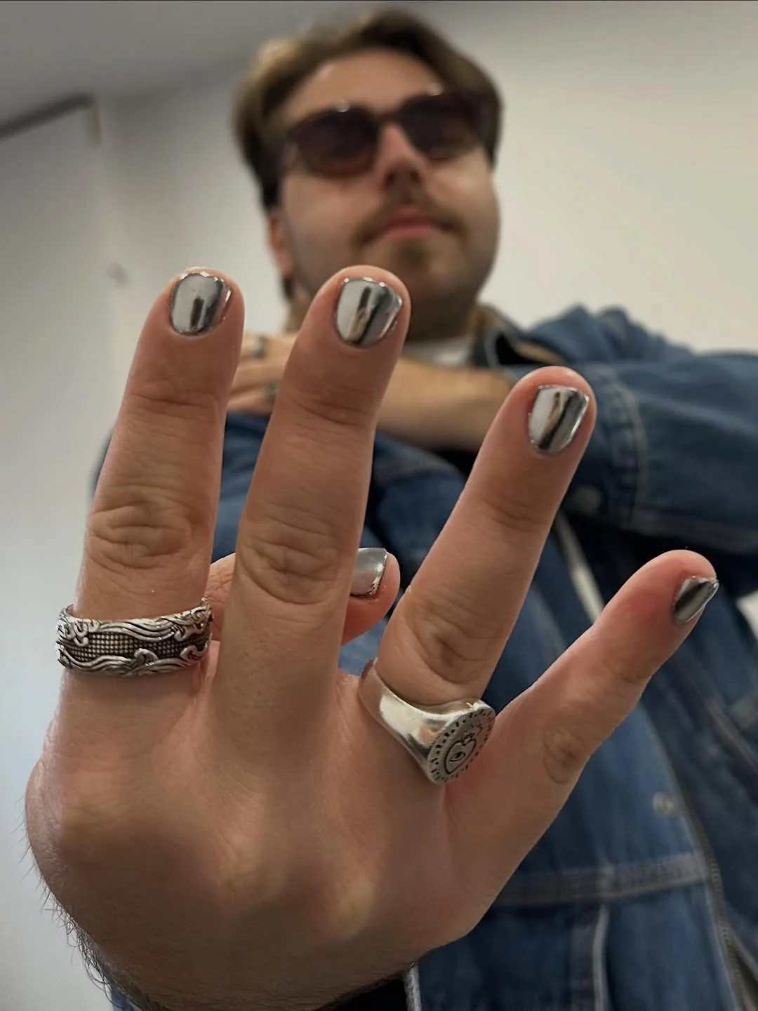 Short men's nails with silver chrome accents