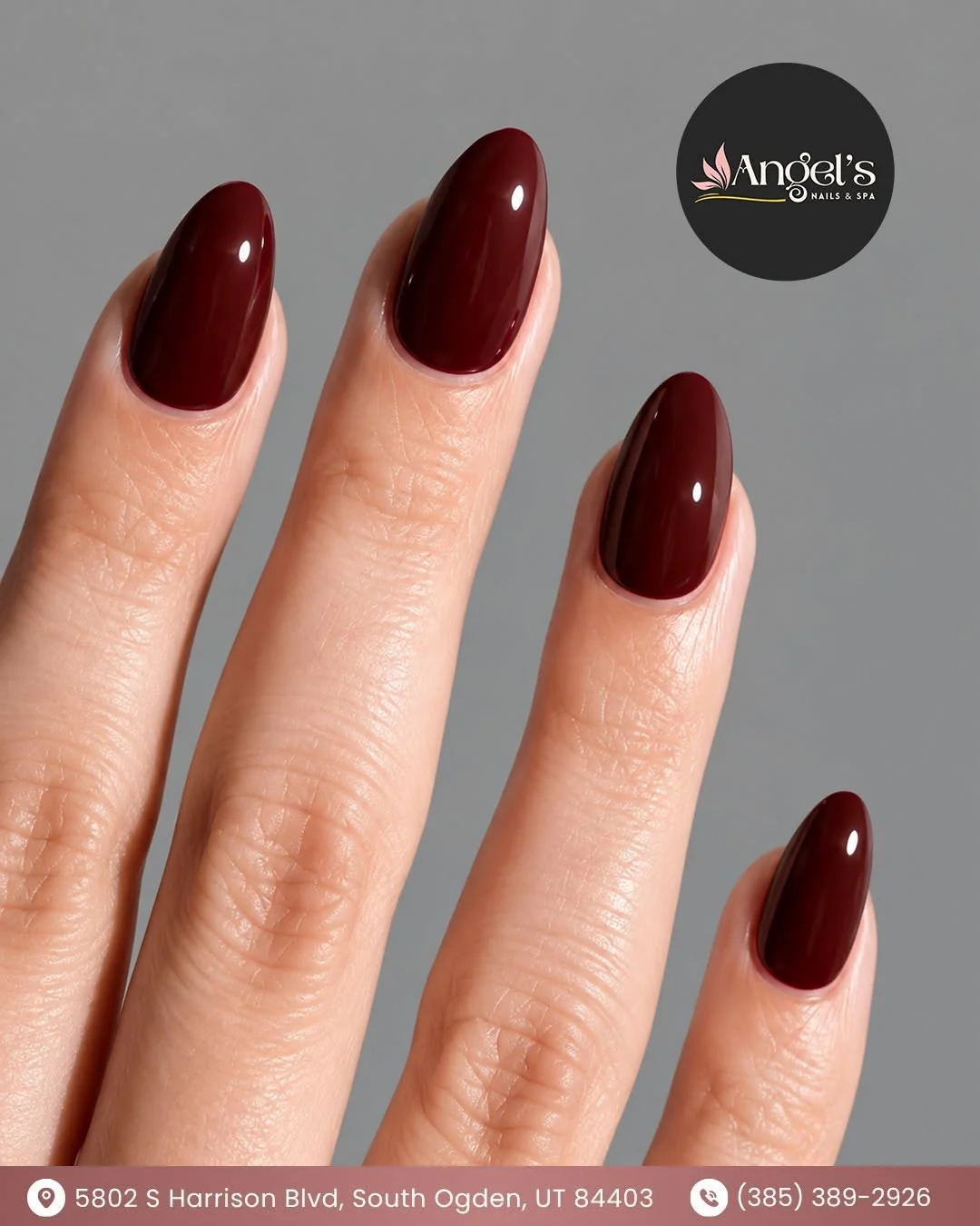 Dark cherry red almond nails with a glossy finish