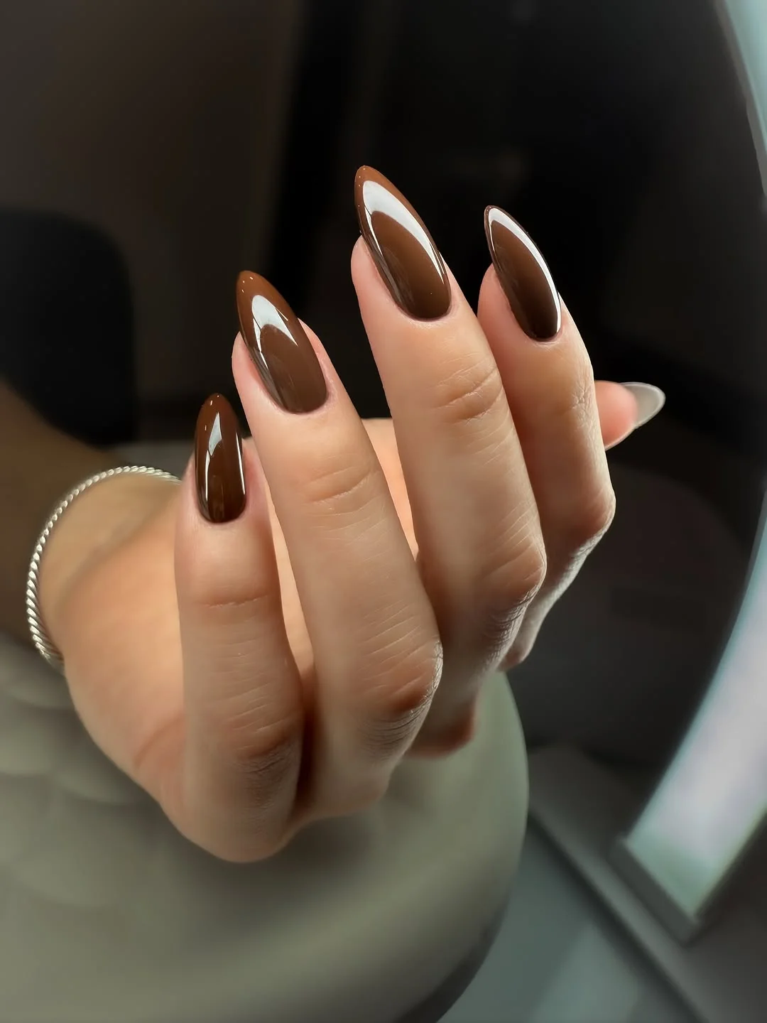 Espresso brown almond nails with milky white edge detail