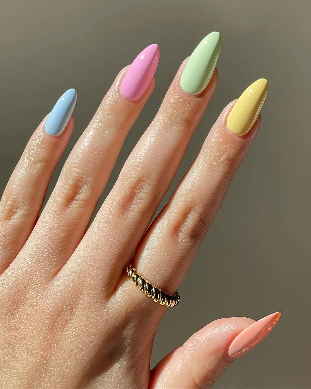 Pastel skittle almond nails in blue, pink, green and yellow