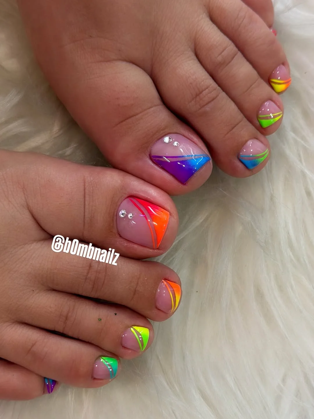 Rainbow French pedicure with colorful diagonal toe tips
