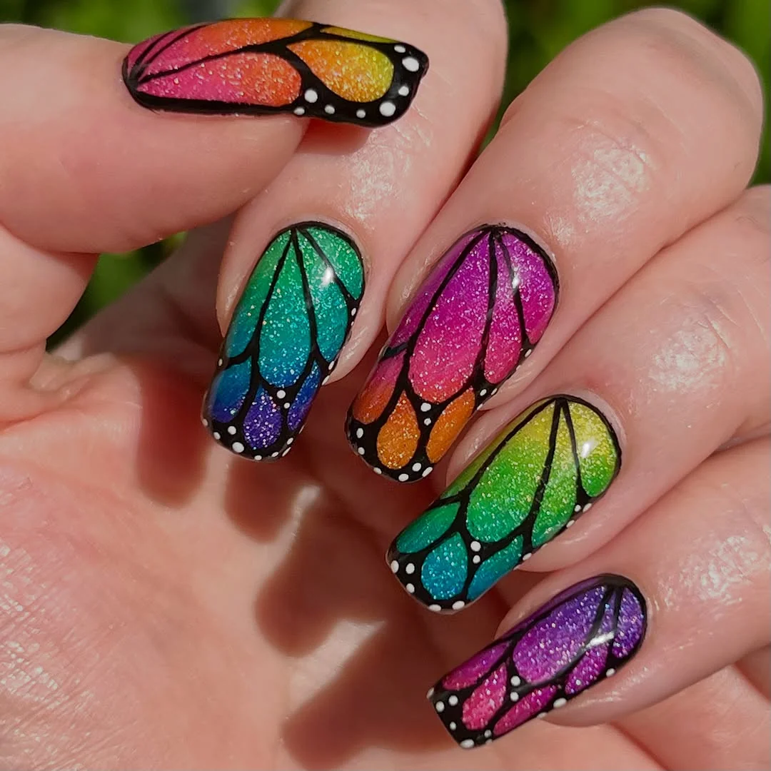 Rainbow Stiletto nail design: rainbow butterfly stained glass almond