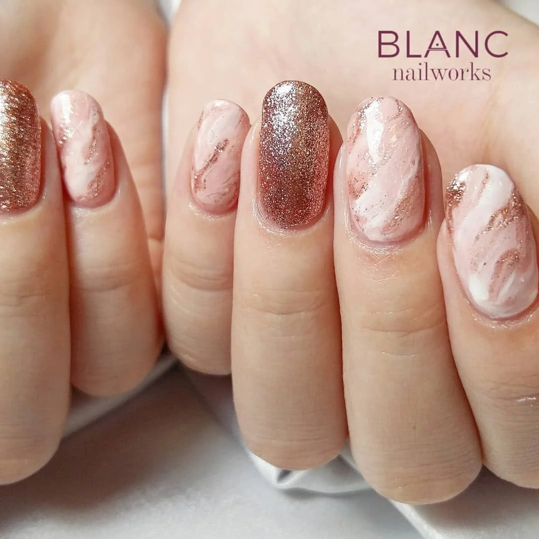 Rose gold glitter and pink marble nails
