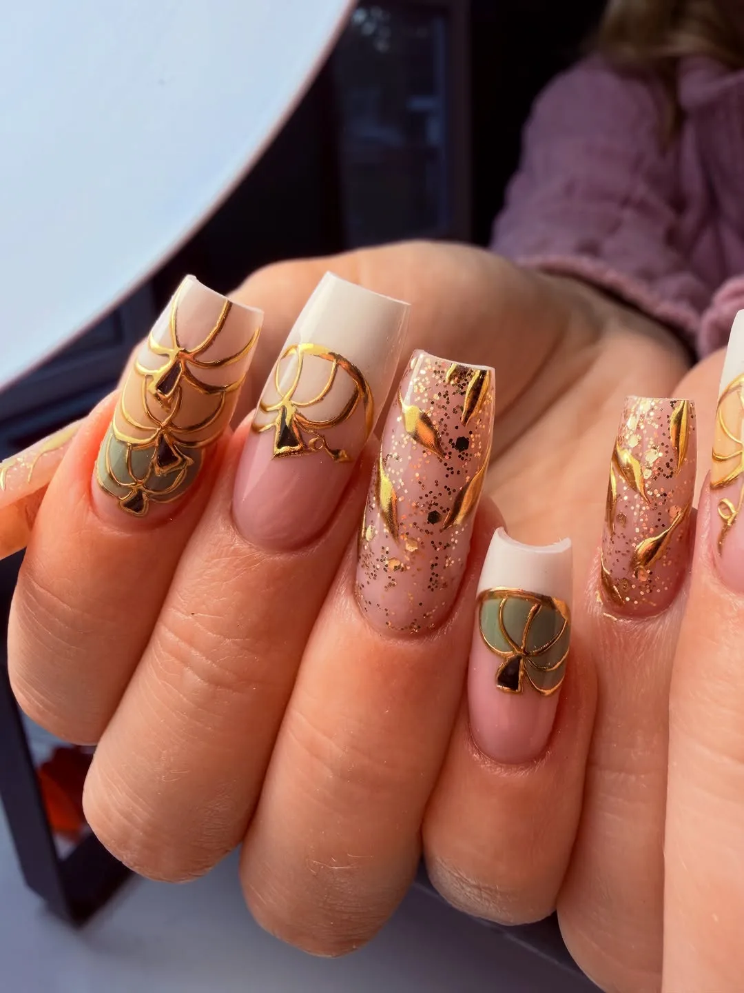Peach nude square nails with gold foil accents