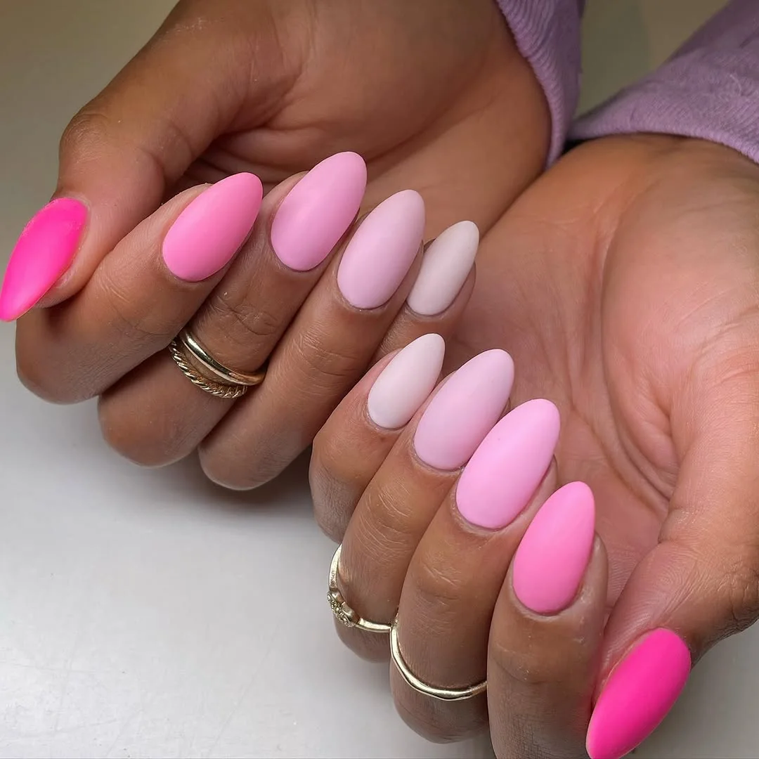 Matte pastel pink almond nails in gradient shades