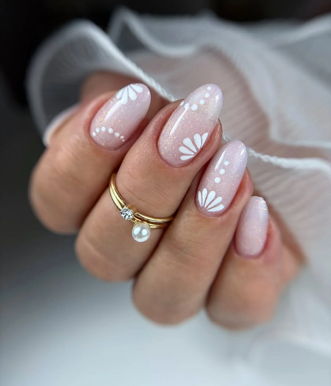 Pearly almond nails with baby's-breath inspired white flower and dot art