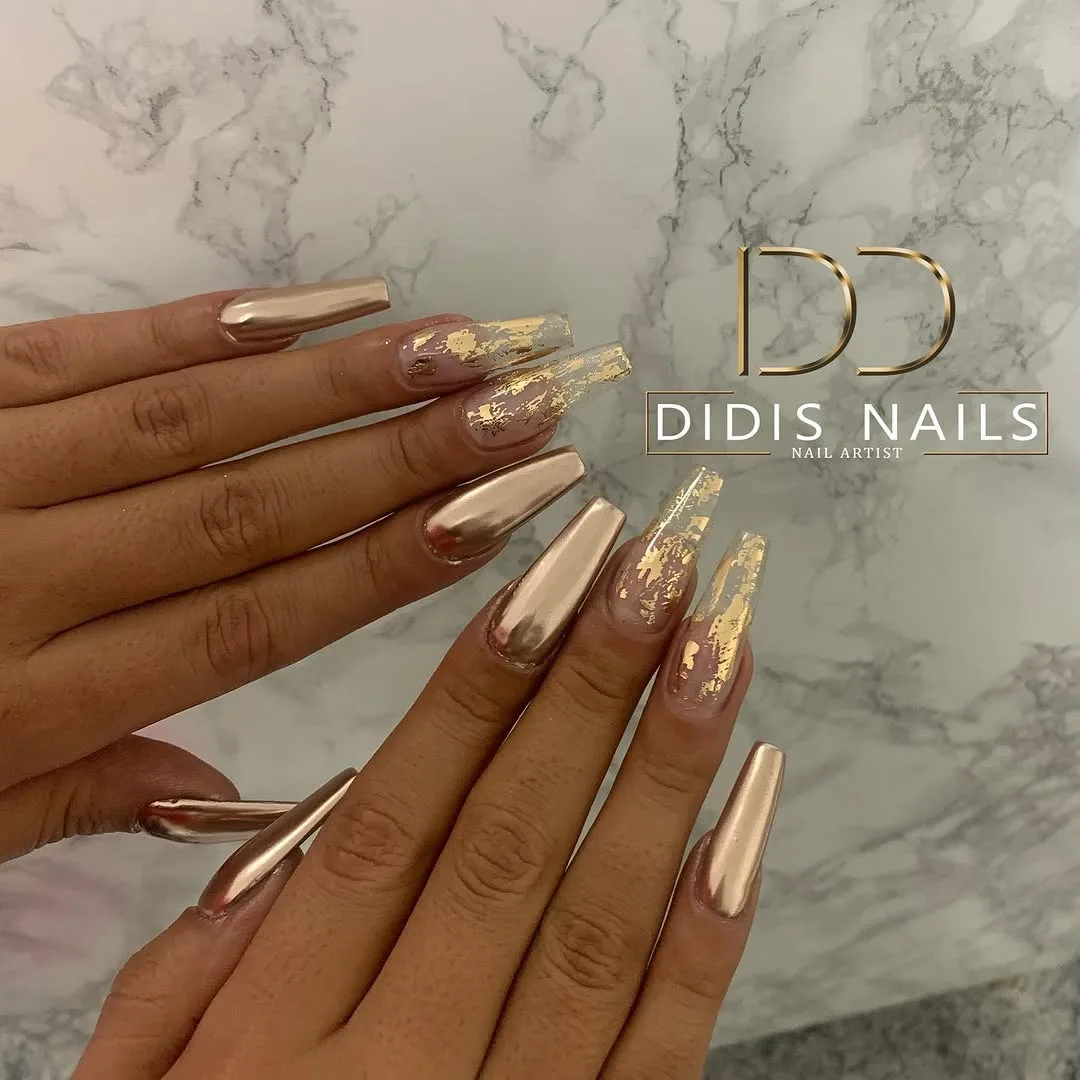 Long nude nails with gold chrome French tips
