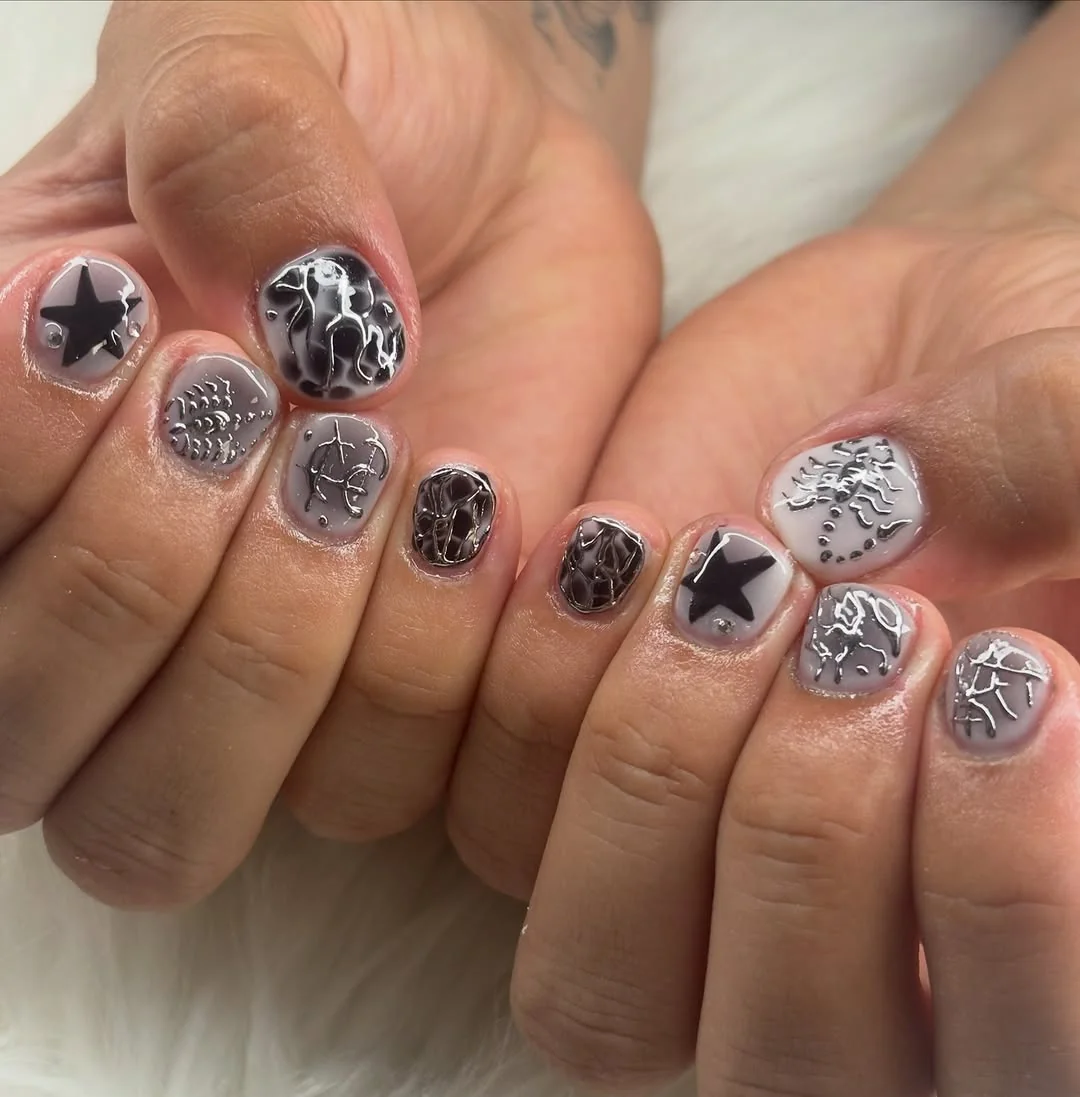 Short gray men's nails with metallic silver star and chrome patterns