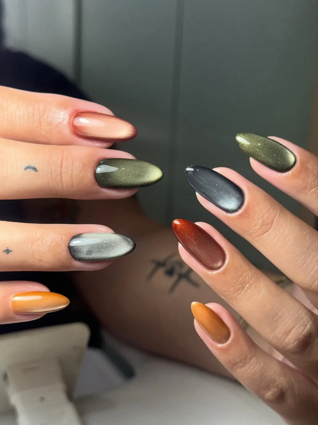 Olive, gray and burnt orange fall cat-eye almond nails