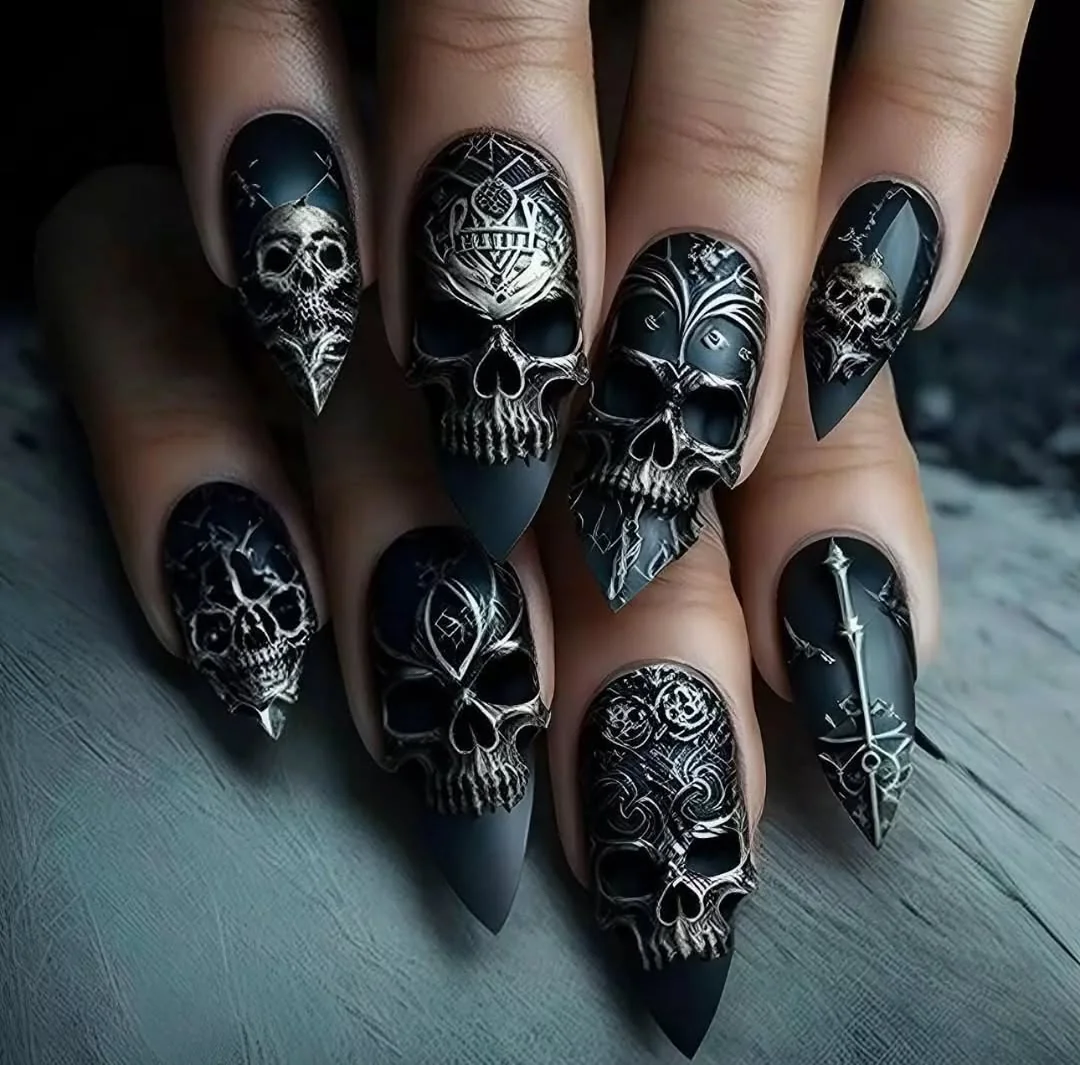 Black stiletto nails with silver skull art for Halloween