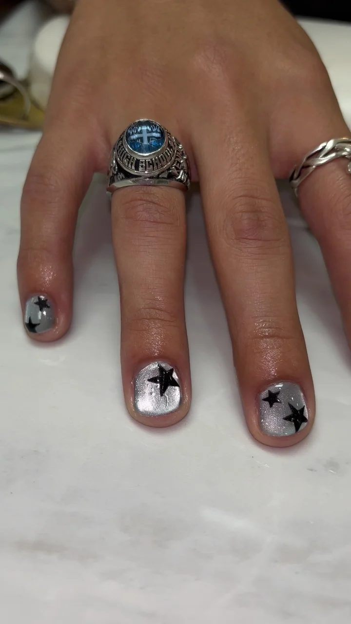 Black Star Short nail design: short almond black stars on nude