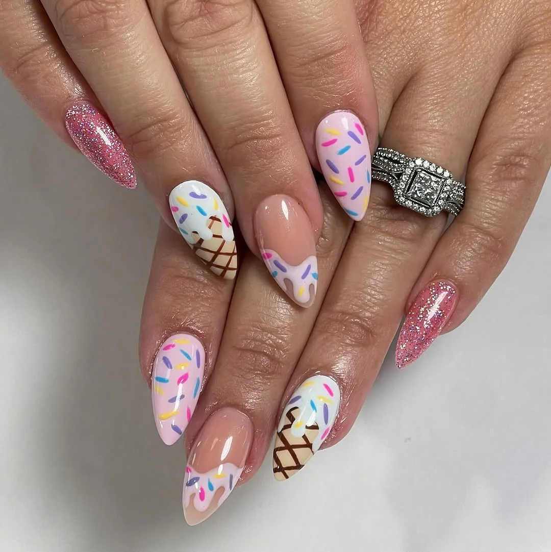 Almond nails with ice cream cone and sprinkle art with pink glitter