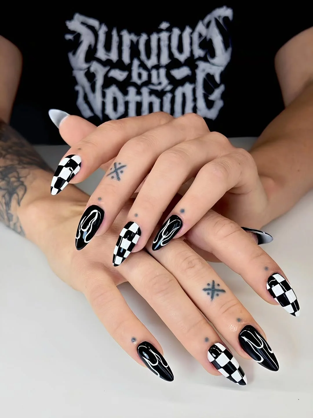 Almond men's nails with black and white checkerboard art