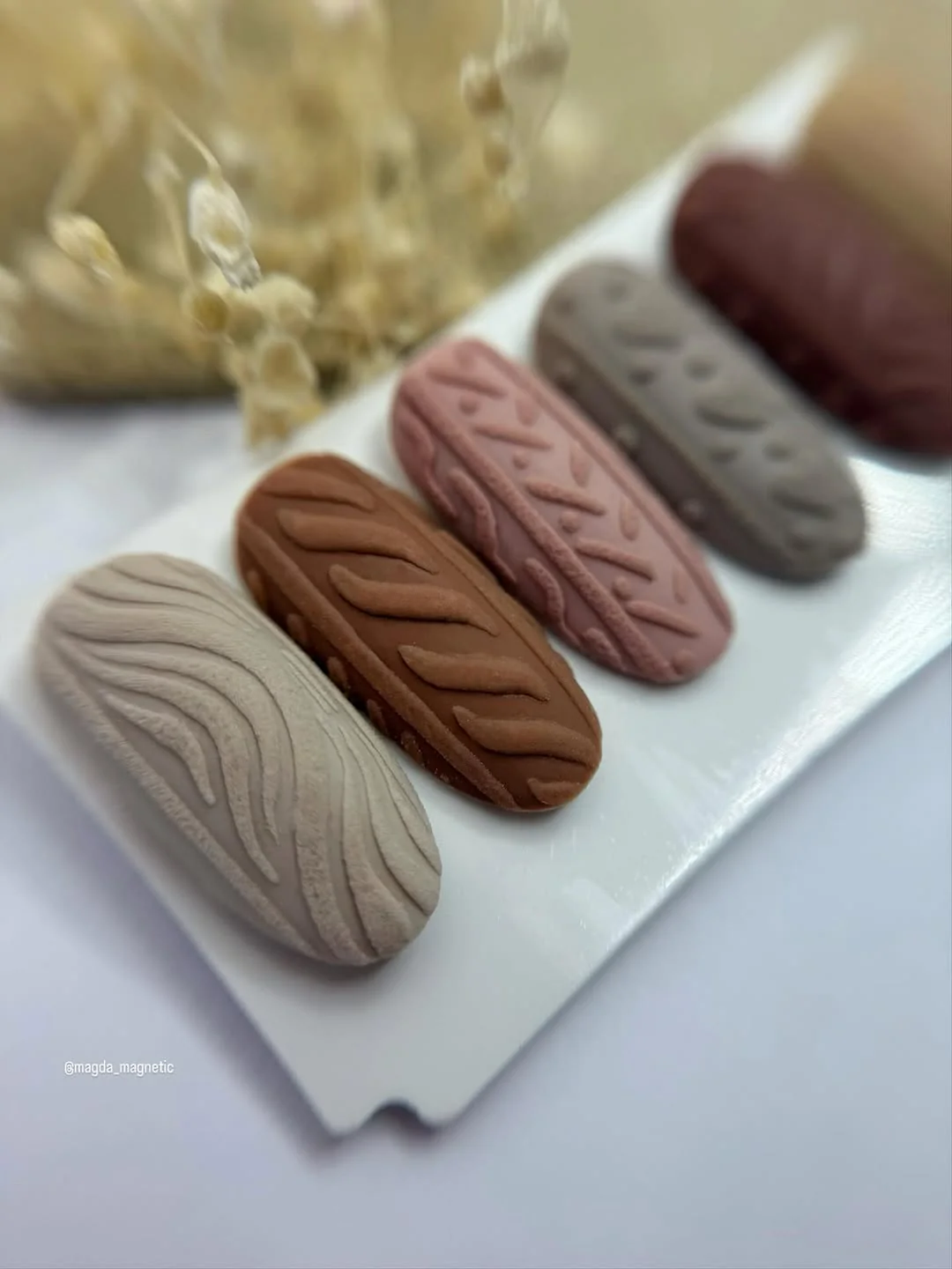 Press-on nails with cable-knit texture in taupe, brown, mauve and gray