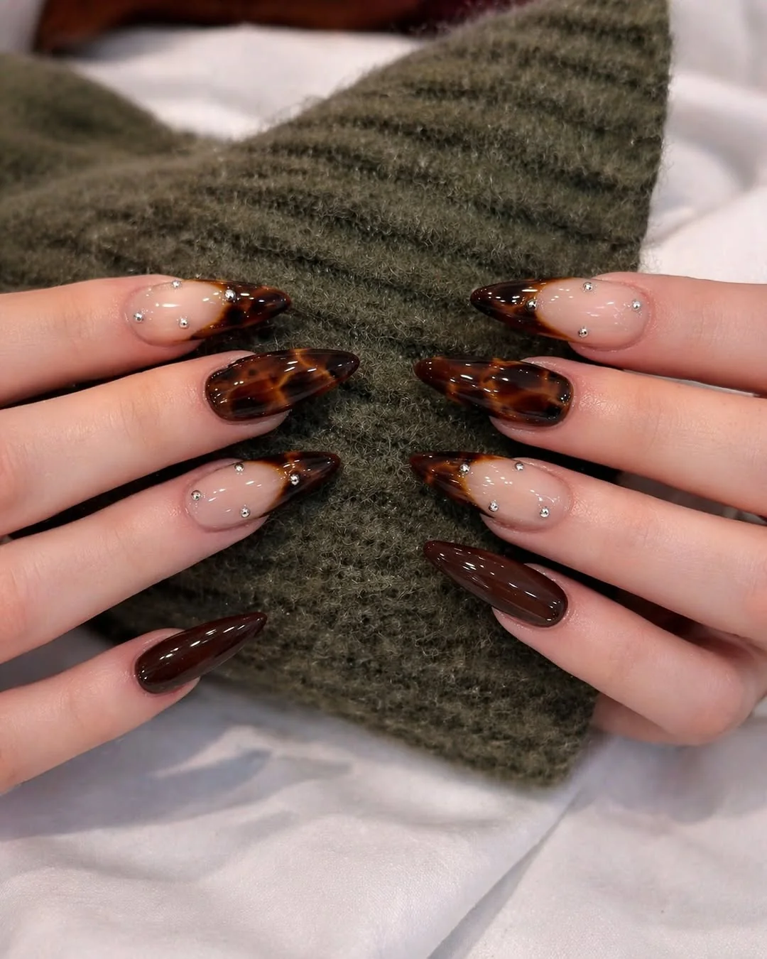 Almond nails with tortoiseshell French tips in chocolate brown