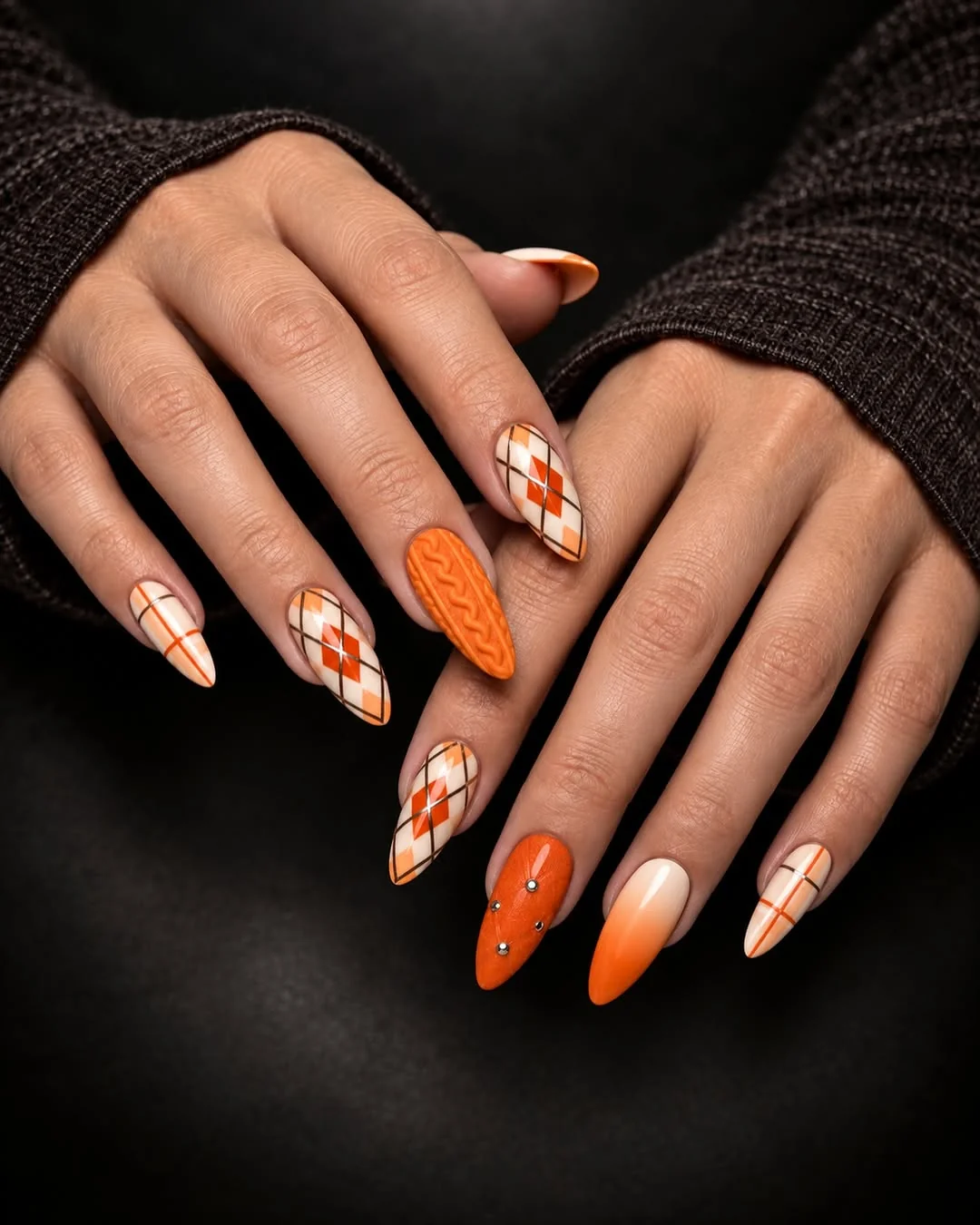 Orange, cream and white almond nails with argyle diamond pattern
