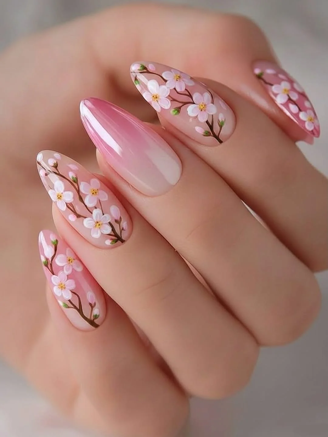 Pink ombré almond nails with cherry blossom branch art