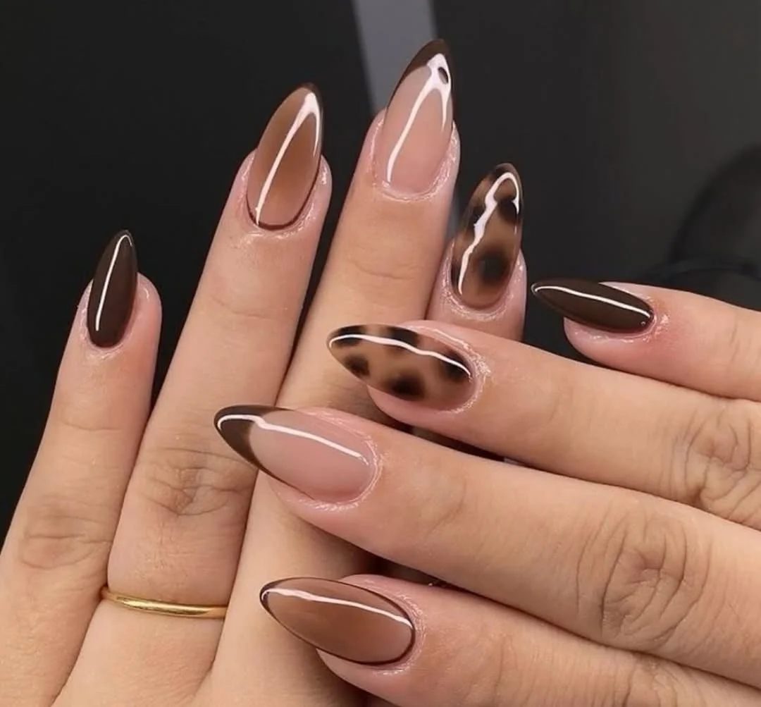 Brown and nude almond nails with tortoiseshell half moon accents