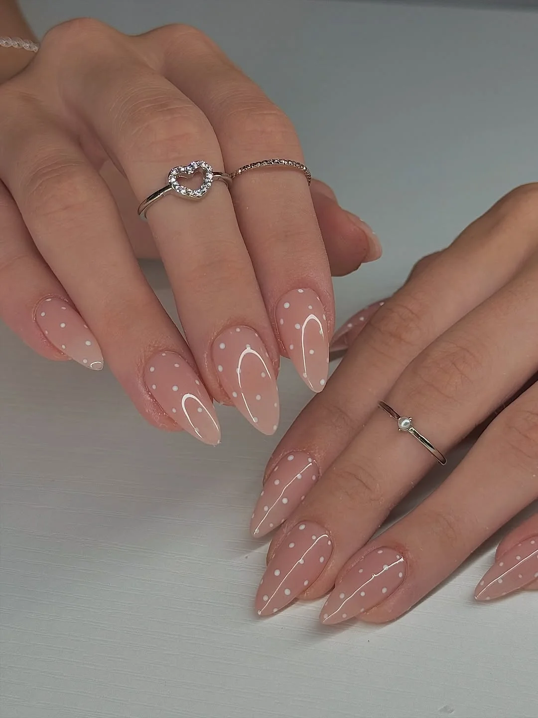 Nude almond nails with a barely-there shimmer