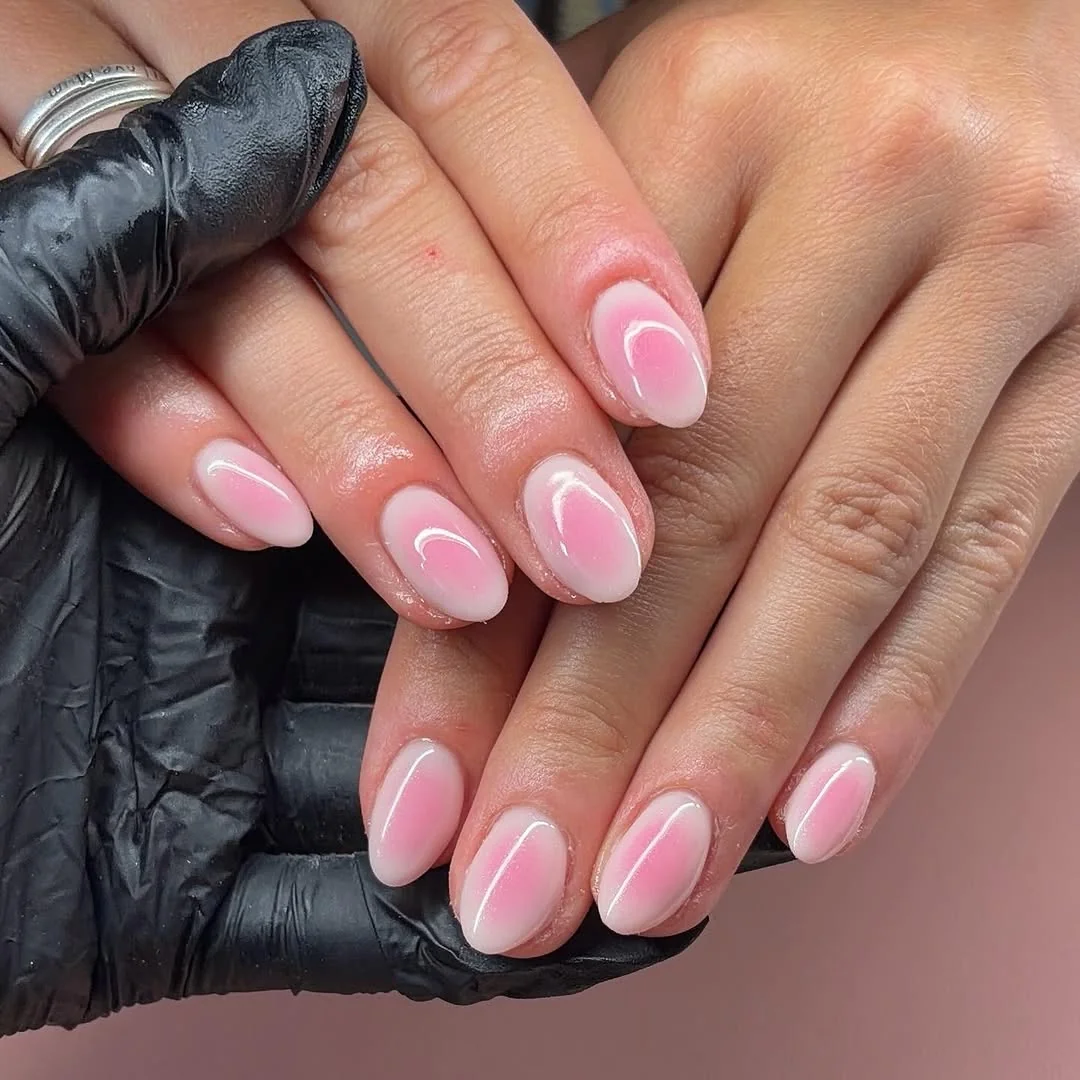 Pink aura almond nails with white outline edges