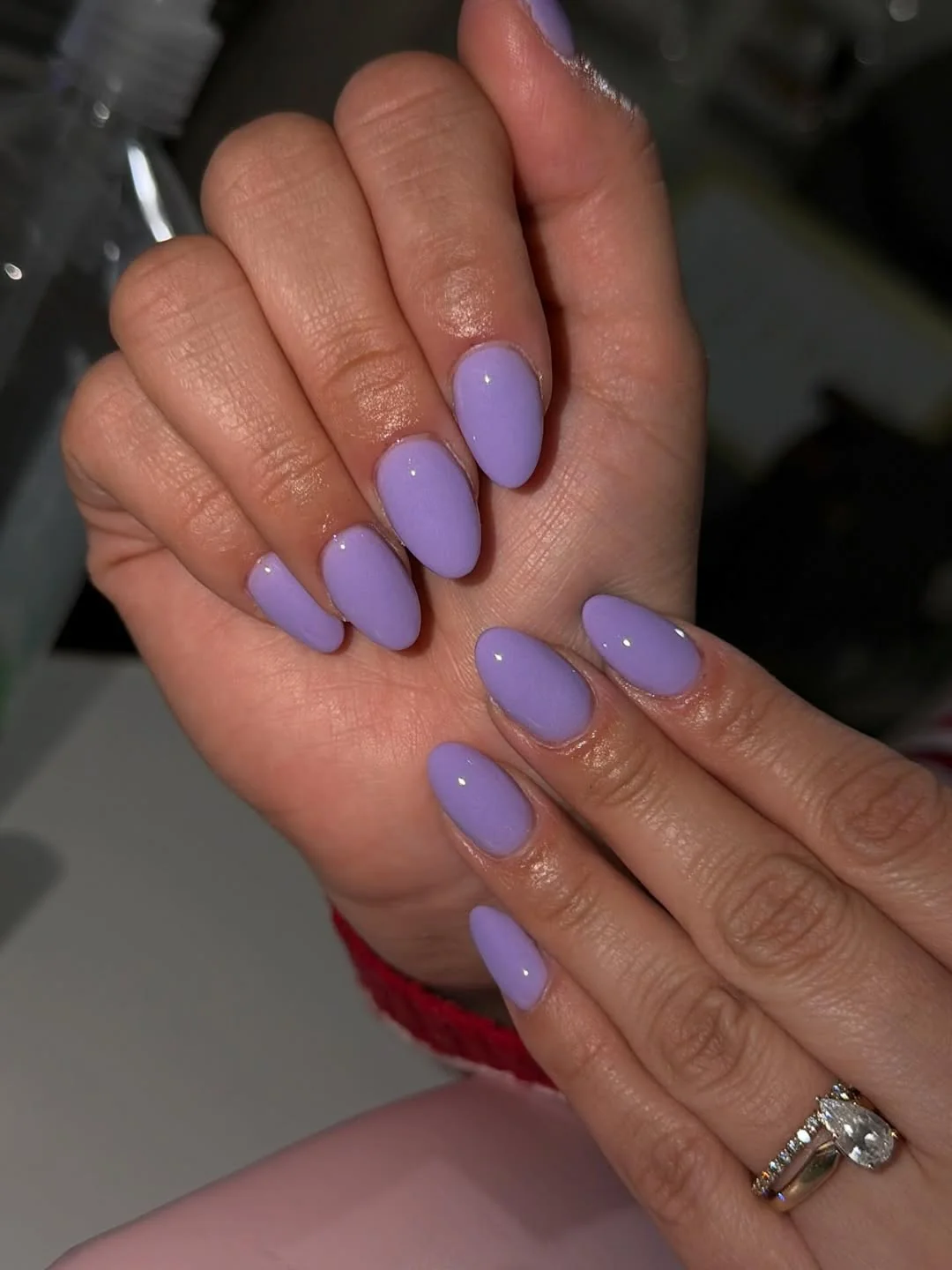 Pastel lavender almond nails with a glossy finish