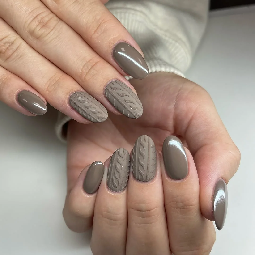 Taupe almond nails with cable-knit sweater texture