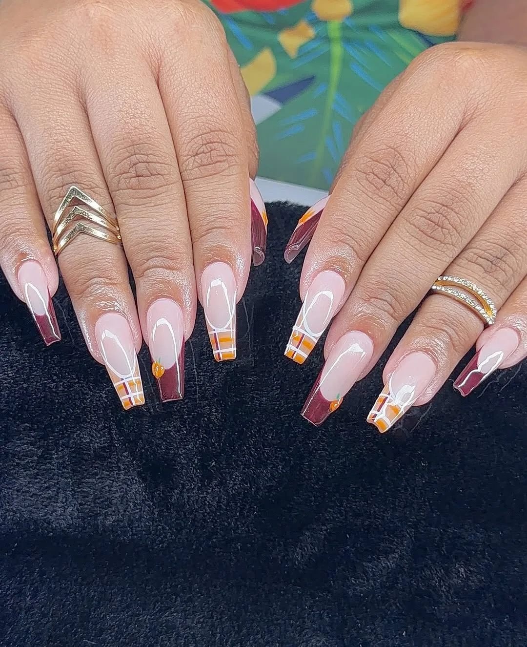 Nude French tip nails with thin gold bands