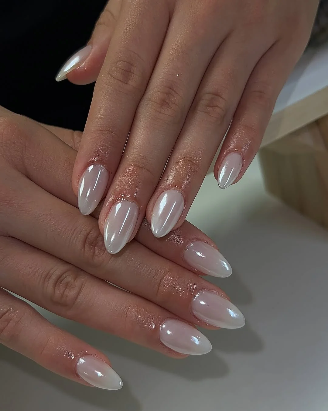 White chrome almond nails with mirror finish