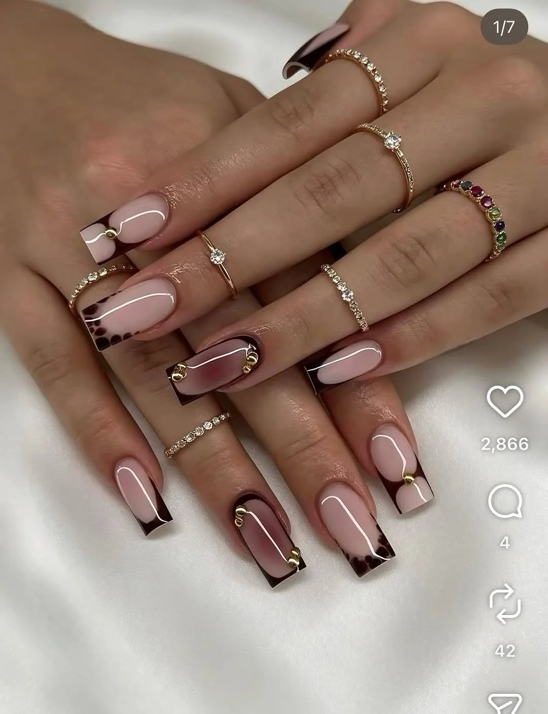 Square nails with chocolate brown French tips and gold line detail