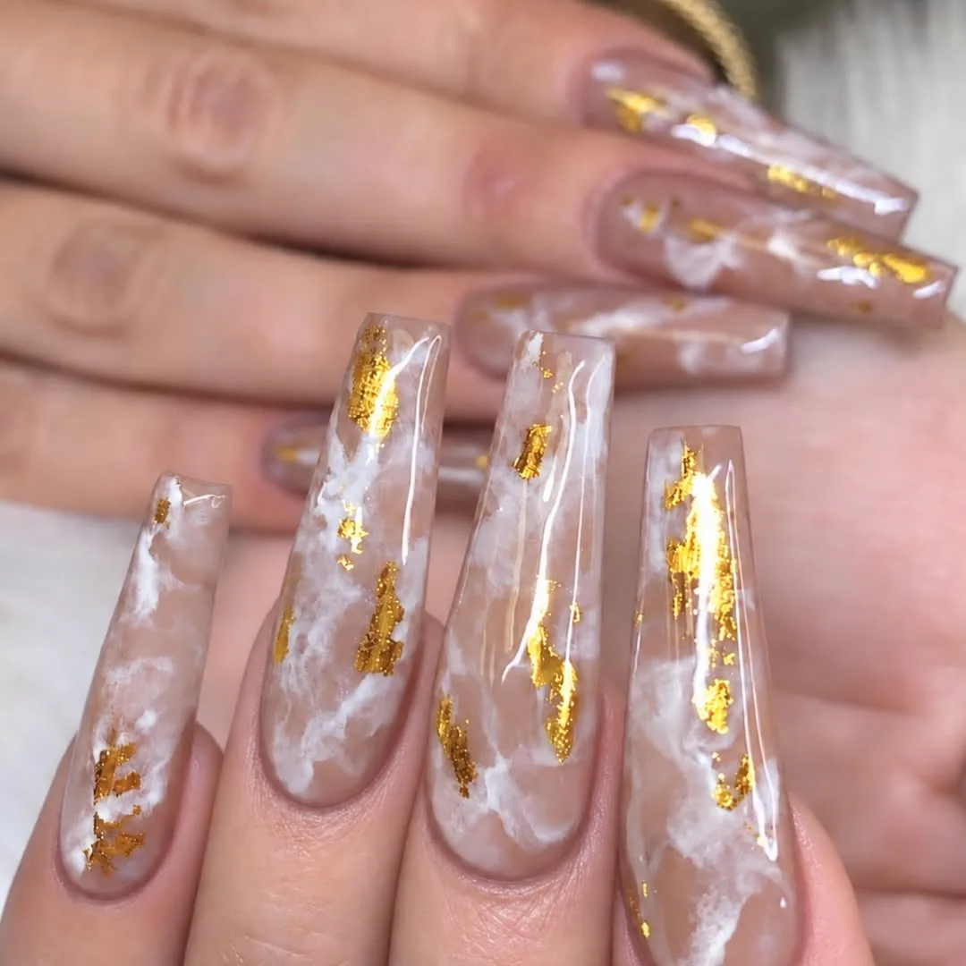 Clear and nude marble coffin nails with gold foil