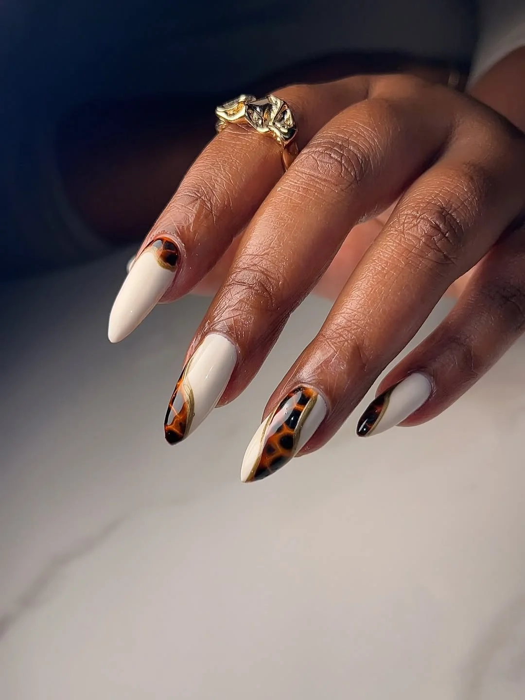 Cream and tortoiseshell almond nails with side French tips