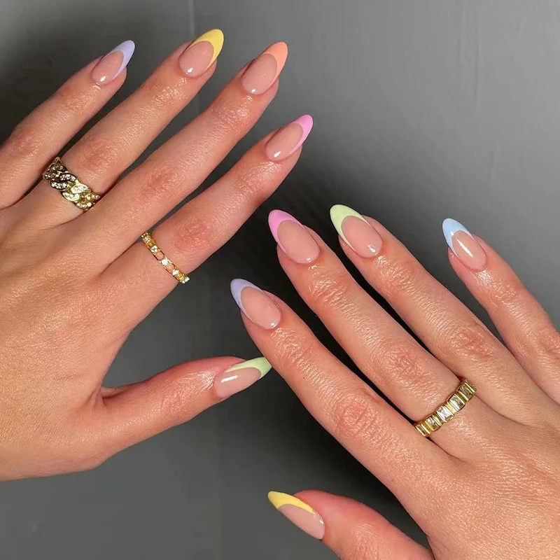 Pastel rainbow French tip almond nails on sheer nude base