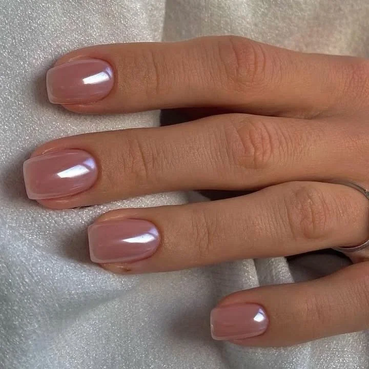 Glazed chrome short square nails in a soft nude pink