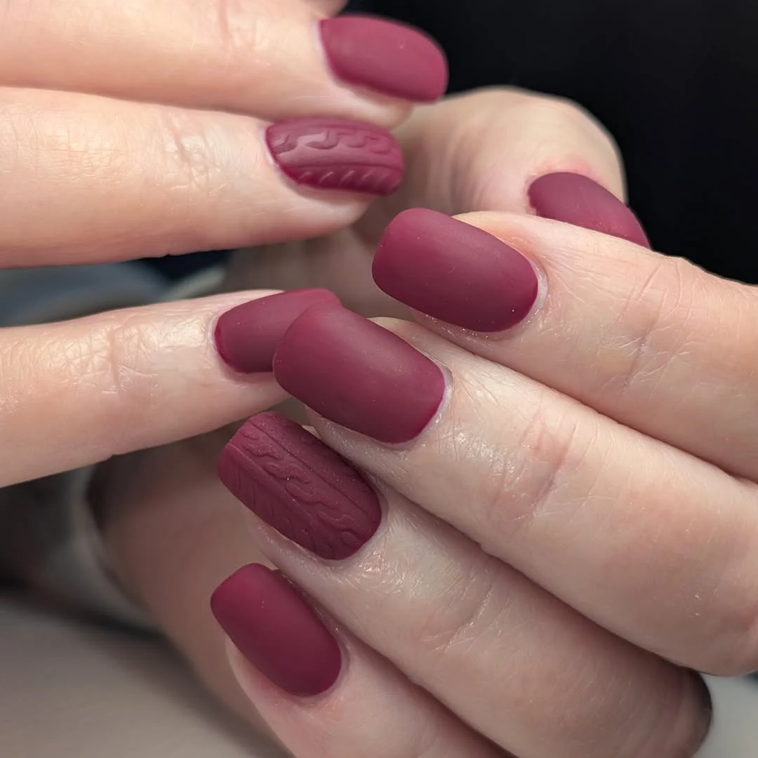 Matte burgundy square nails with cable-knit accent nails