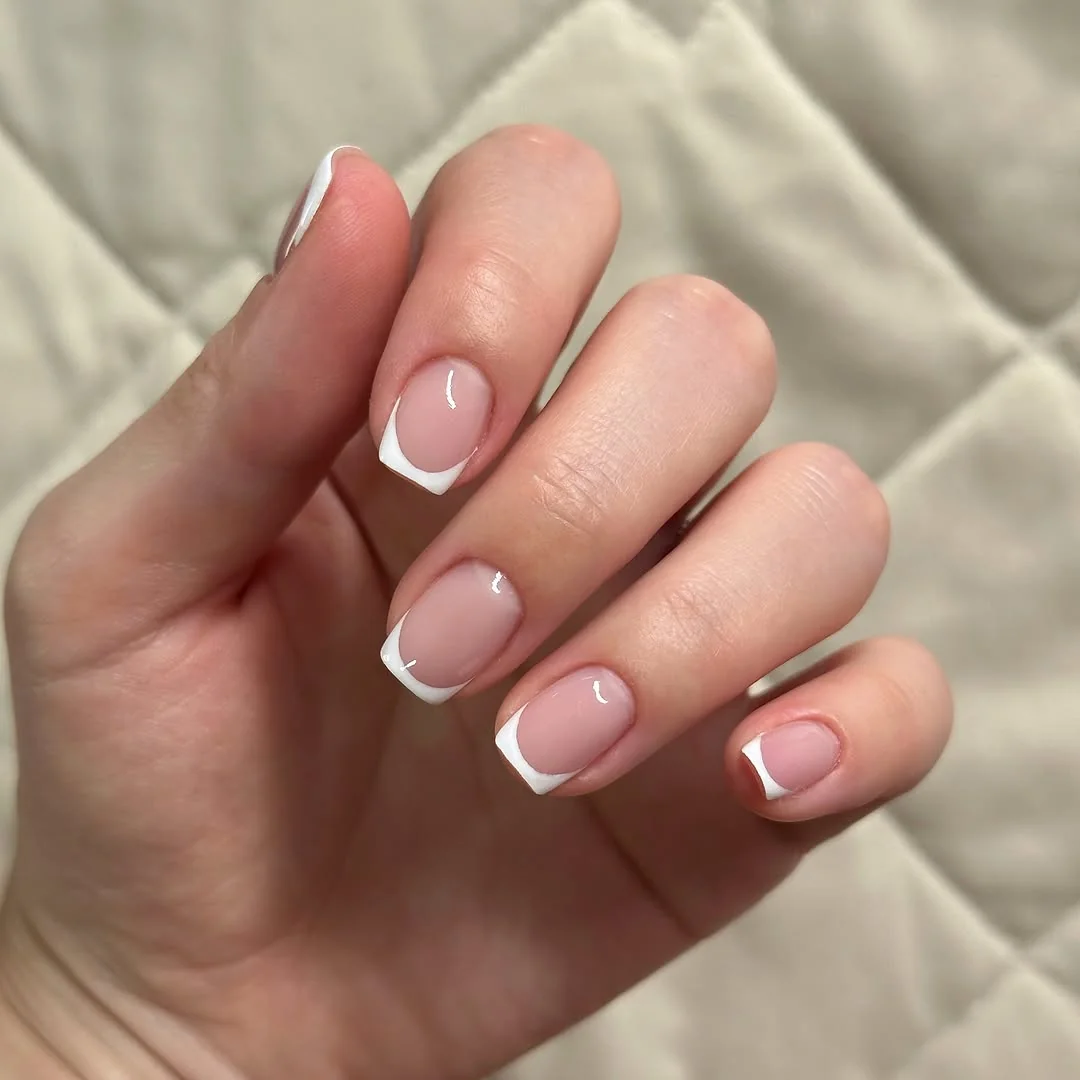 Short nude nails with white side French tips